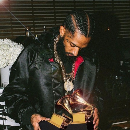 Nipsey Hussle with two Grammy Awards.